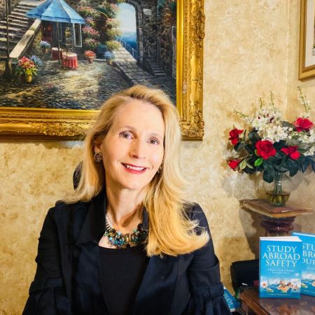 Carrie Pasquarello is pictured with the two books she's written about safe travel.